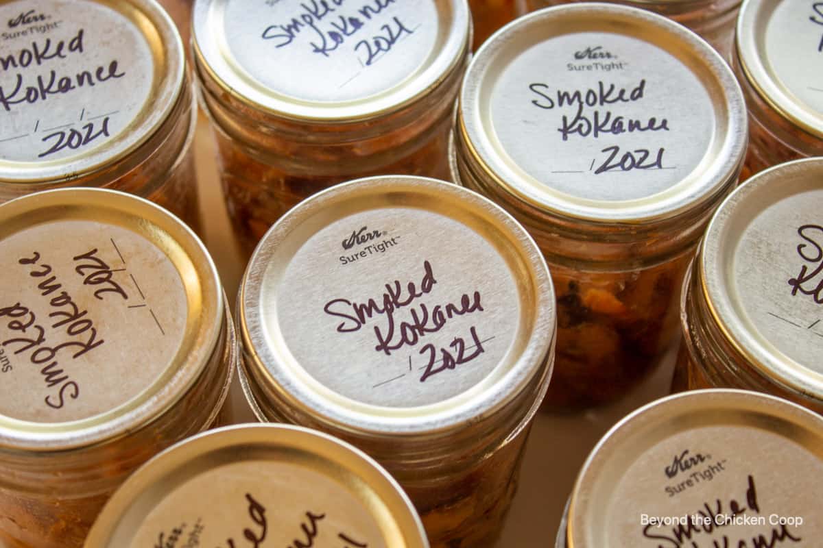 Jars of smoked kokanee with name and date.