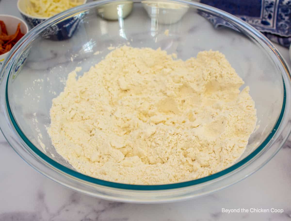 Flour mixed with butter in a bowl.