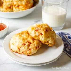 Two biscuits on a white plate.