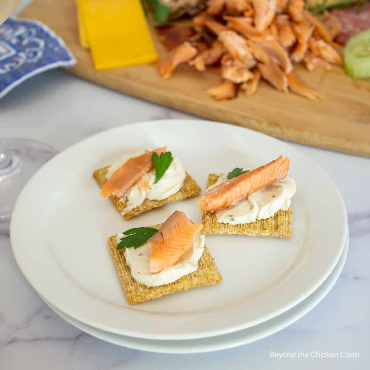 Smoked salmon on crackers with cream cheese.