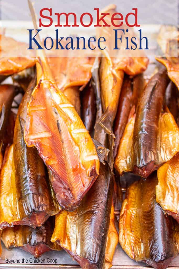 Smoked fish piled on a wire rack.