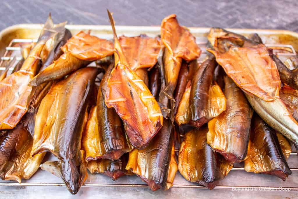 Smoked fish on a wire rack.