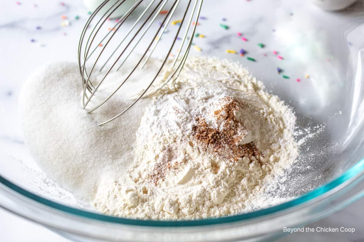 Flour, sugar and spices in a mixing bowl.