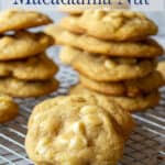 Cookies stacked on a baking rack.