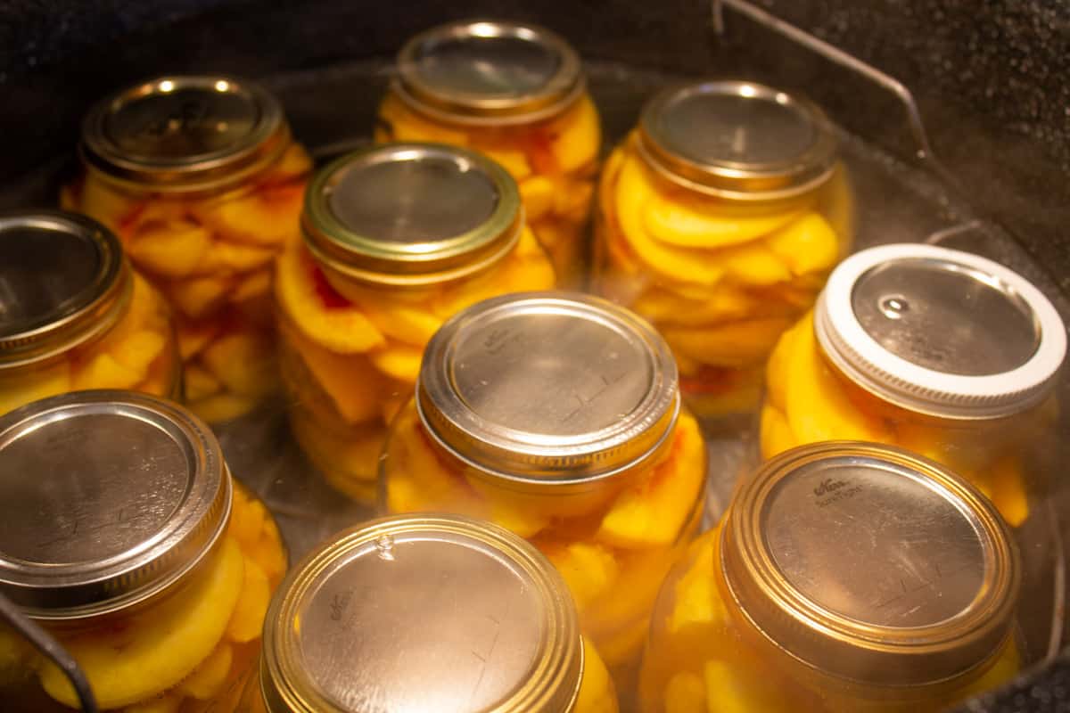 Canning jars in a water canner.