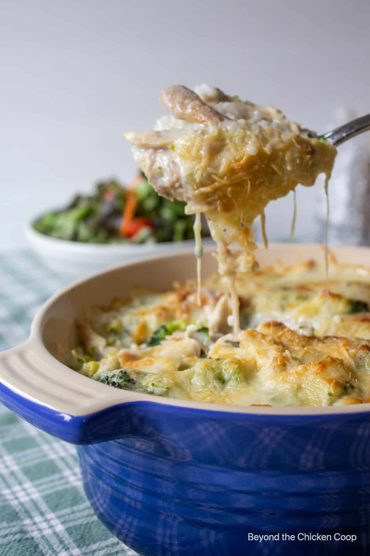 A spoonful of a cheesy casserole.