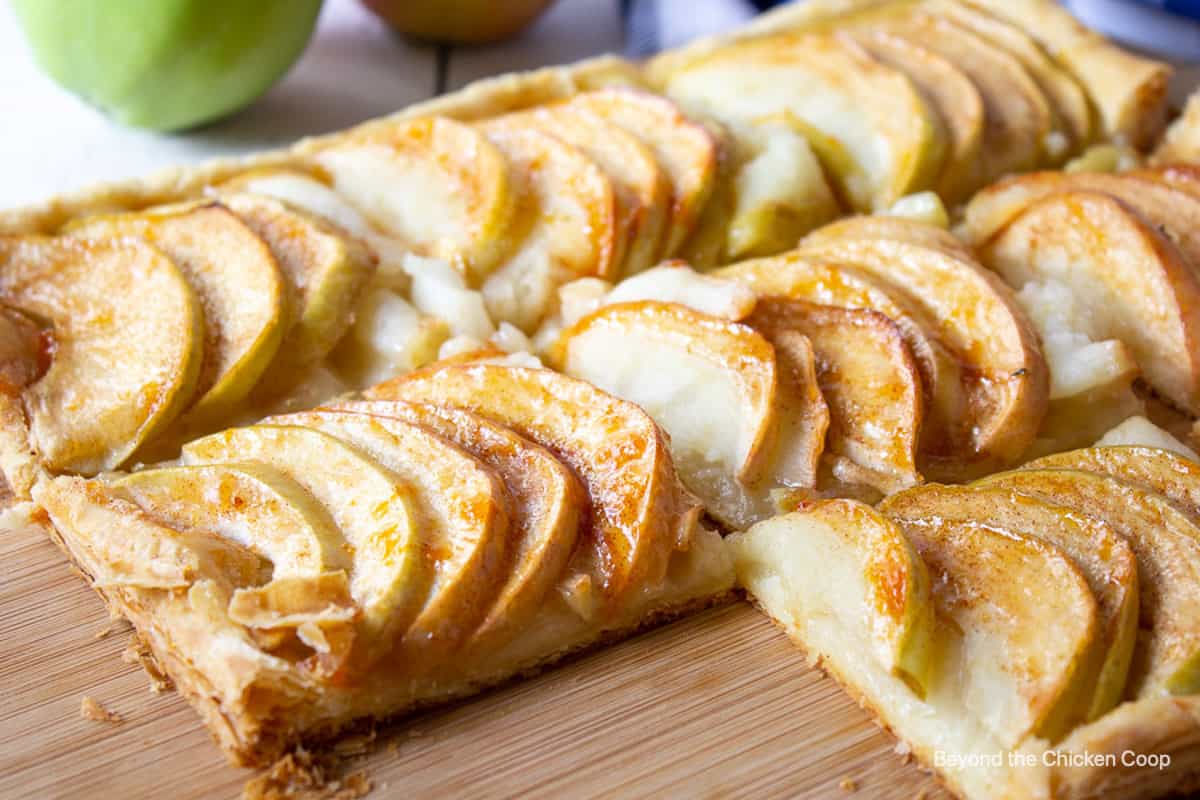 Puff pastry apple tart on a wooden board.