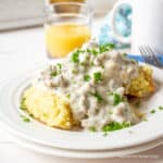 Cut biscuits topped with sausage gravy.
