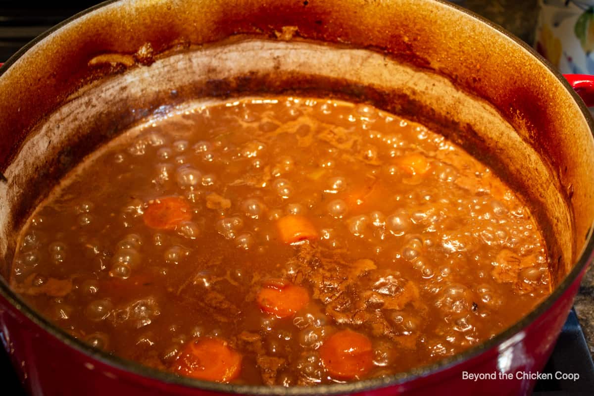 Sauce being reduced in a pot.