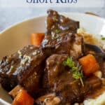 Short ribs with carrots and a rich sauce.