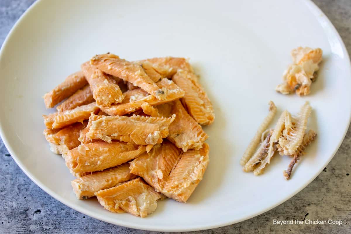 Fish and bones on a plate.