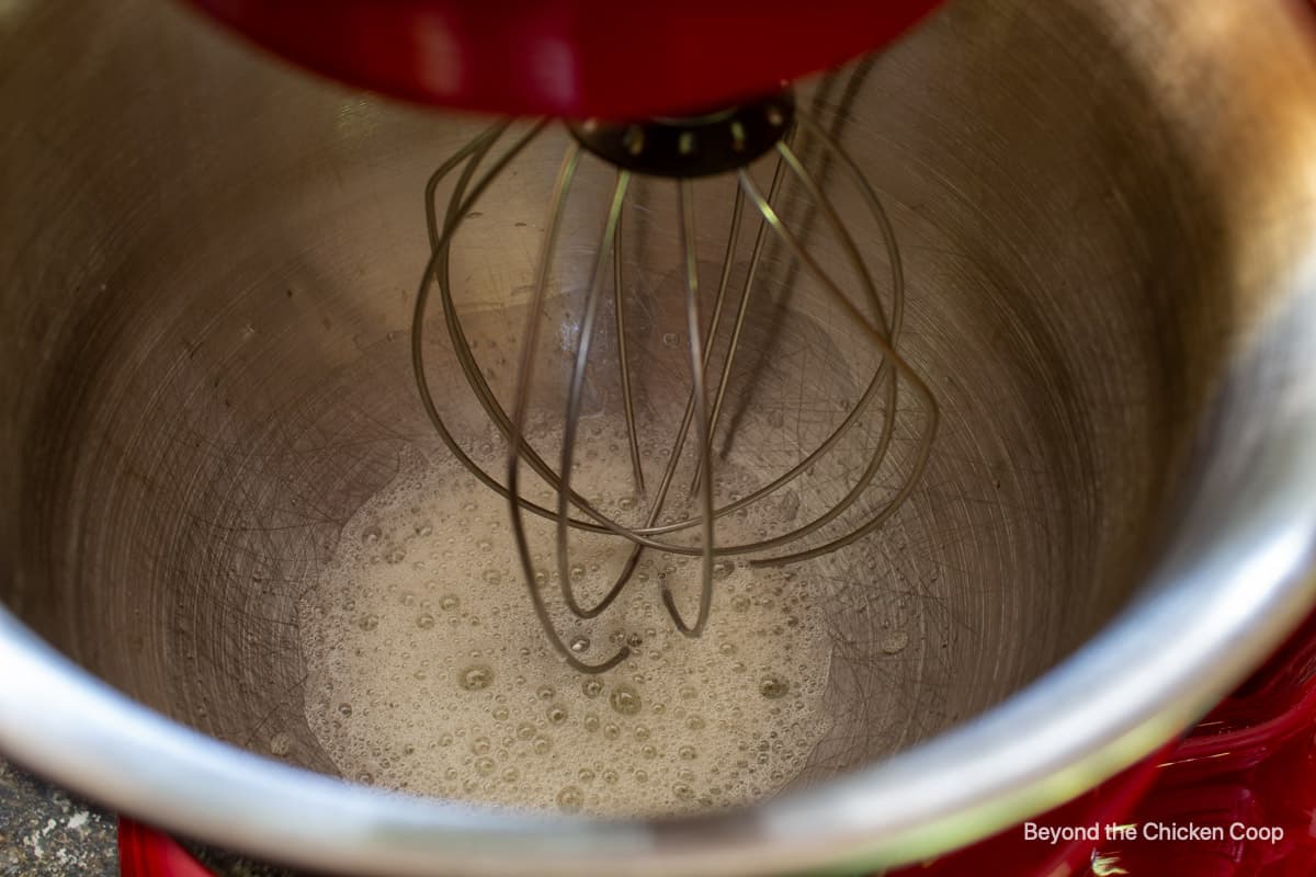 Foamy egg whites in a mixer.