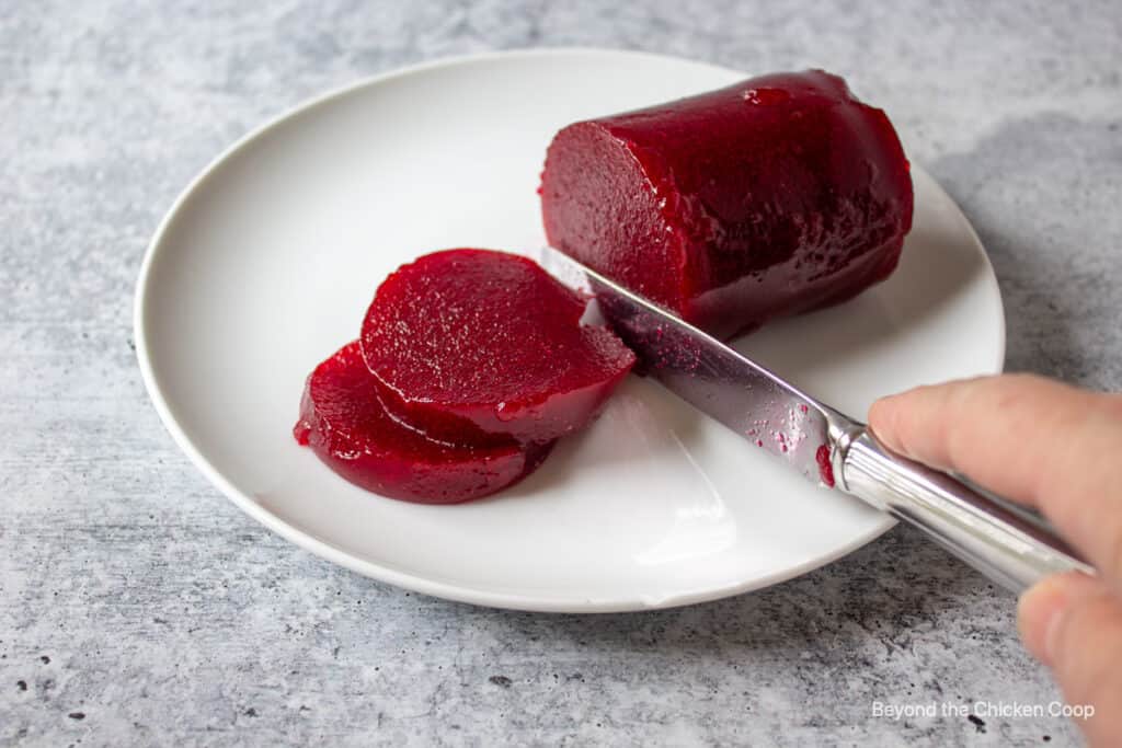 Slice jellied cranberry sauce.