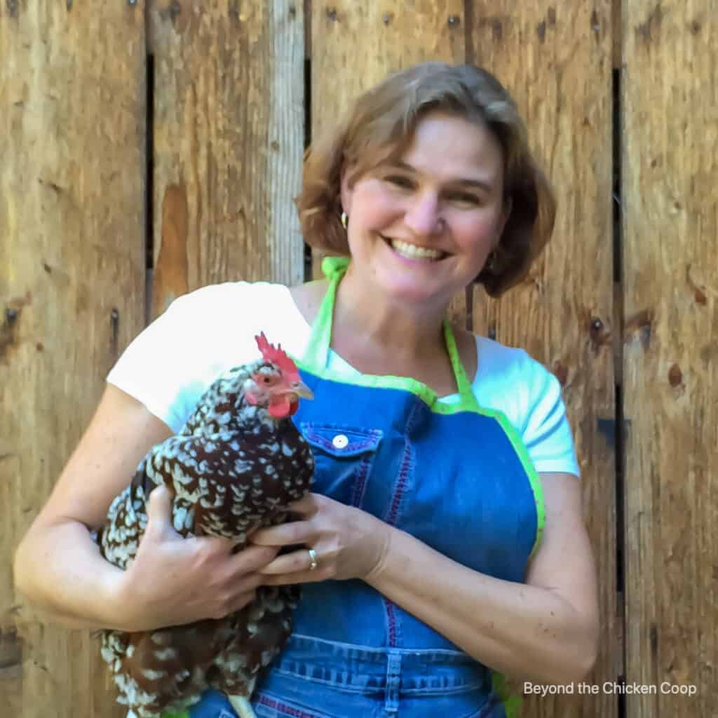 The author holding a chicken.