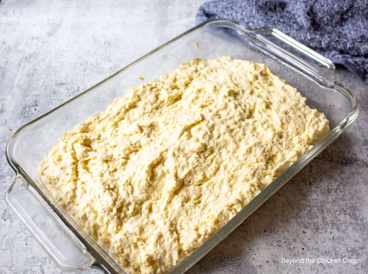 Biscuit dough in a baking dish.