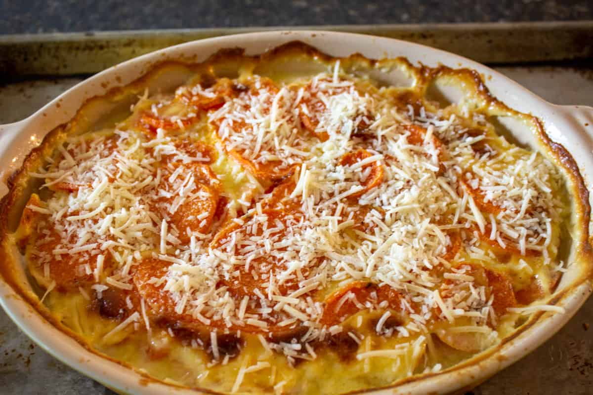 Sprinkled parmesan cheese on the top of a casserole.