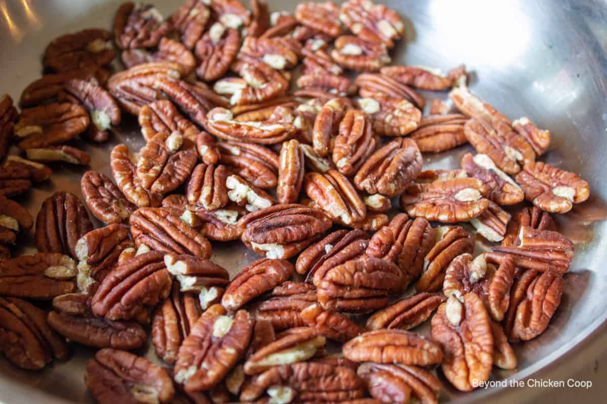 Pecans in a frying pan.