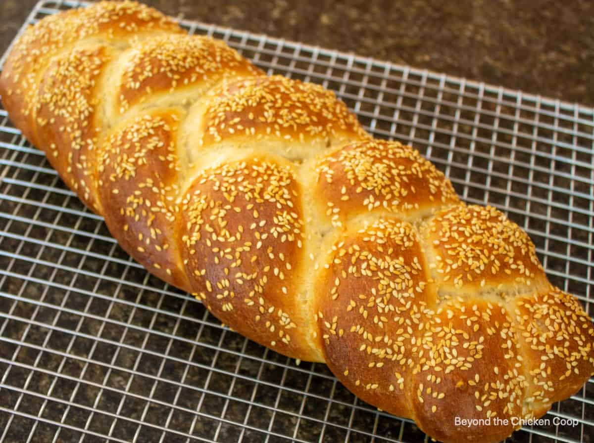 A baked loaf of bread topped with sesame seeds.