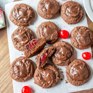 Chocolate cookies with a cherry in the center.