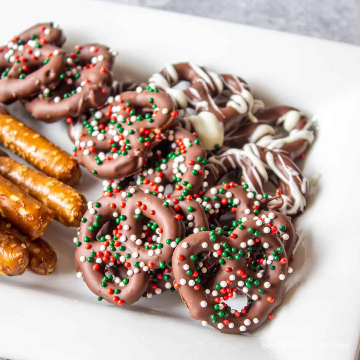 Small pretzel twist covered with chocolate and sprinkles.