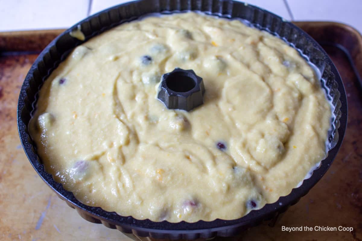 A bundt pan filled with cake batter.