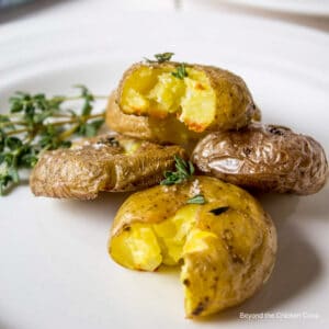 Crispy round baby potatoes topped with fresh herbs.