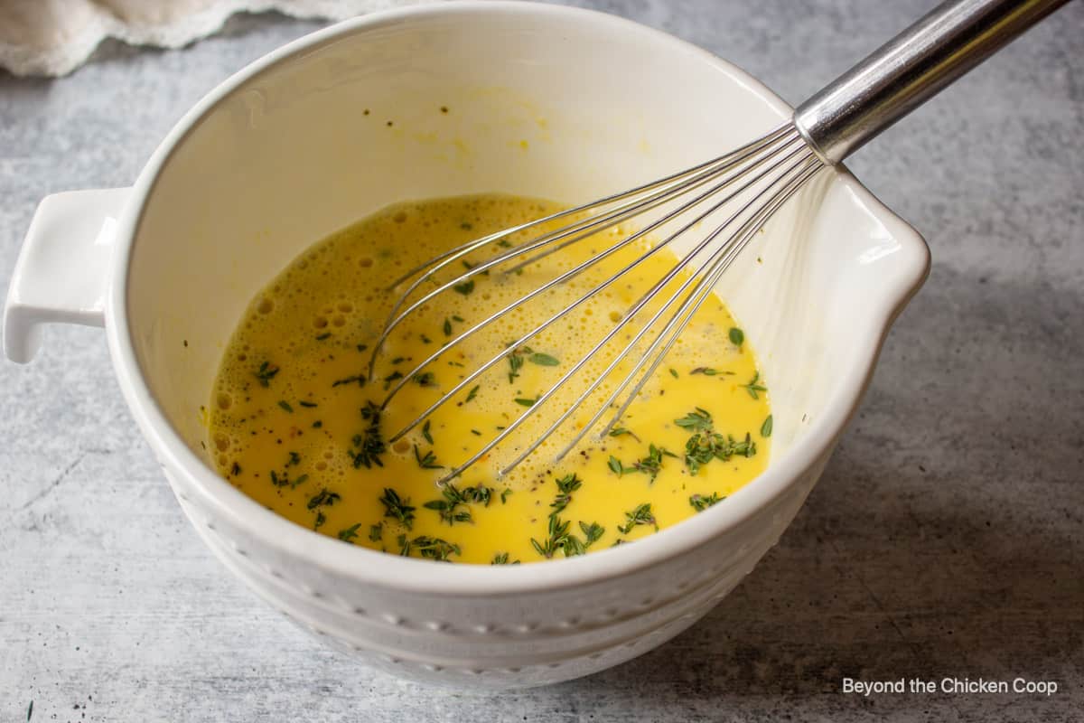 Whipped eggs in a bowl.