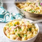 Pasta shells with bits of ham and peas.