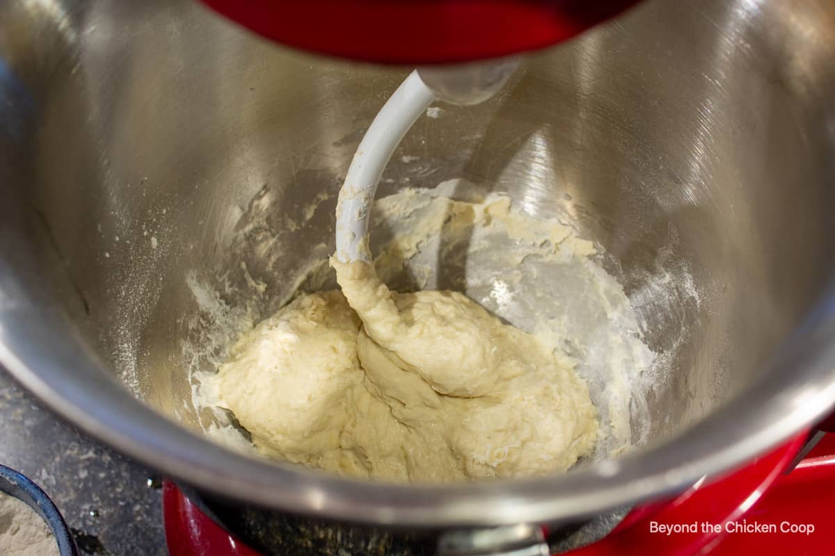 Adding flour to yeast dough.