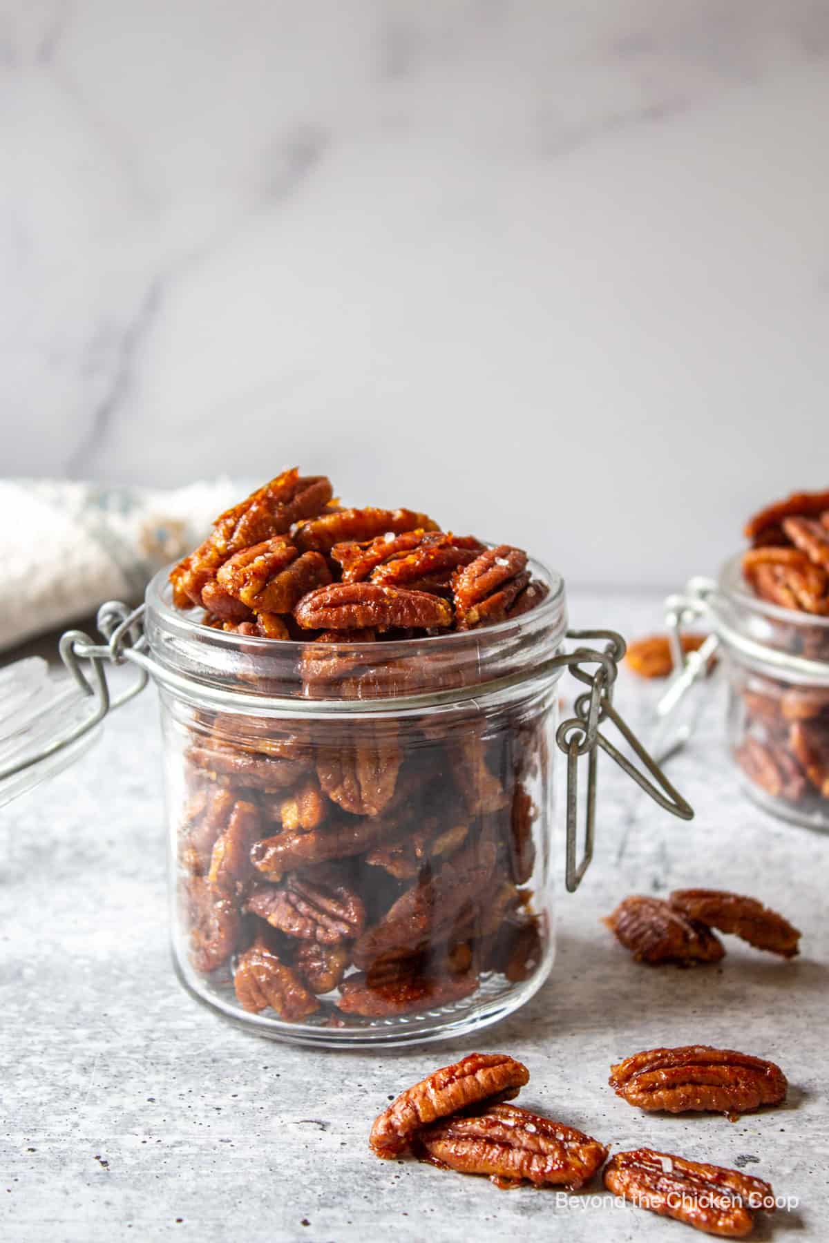 Spiced nuts in a glass container.