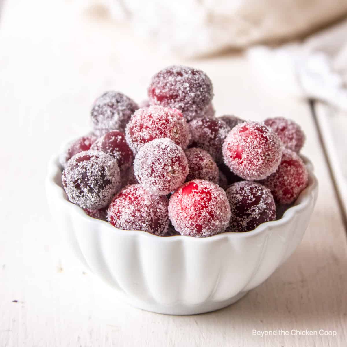 A bowlful of cranberries covered with sugar.