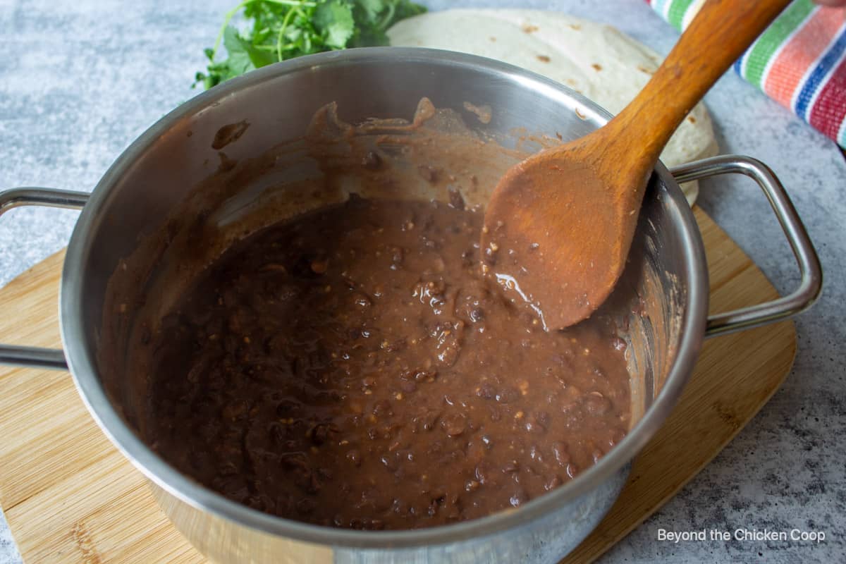 Black beans cooked in a pot. 