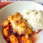 A cobbler with peach slices and blackberries.