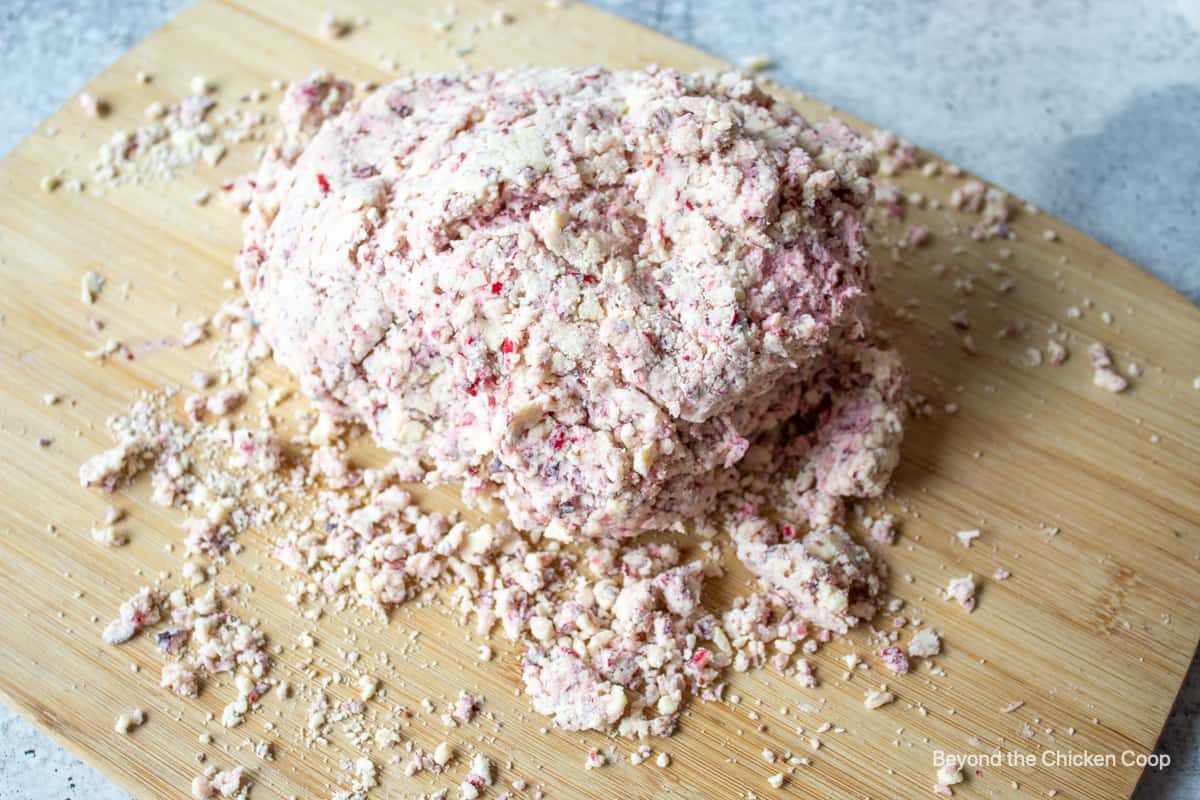 Crumbly scone dough on a board.