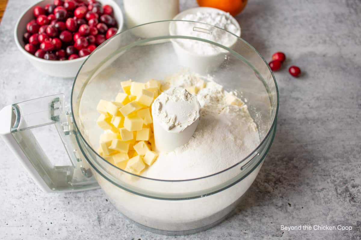 Butter and flour in a food processor bowl.