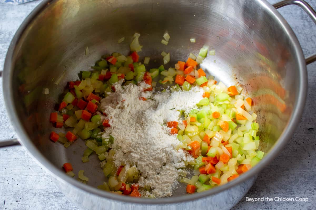 Flour added to cooked veggies.