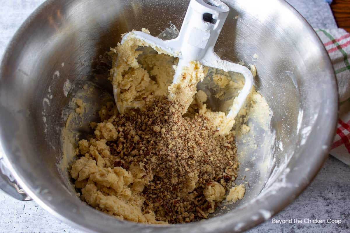 Chopped pecans added to cookie dough.