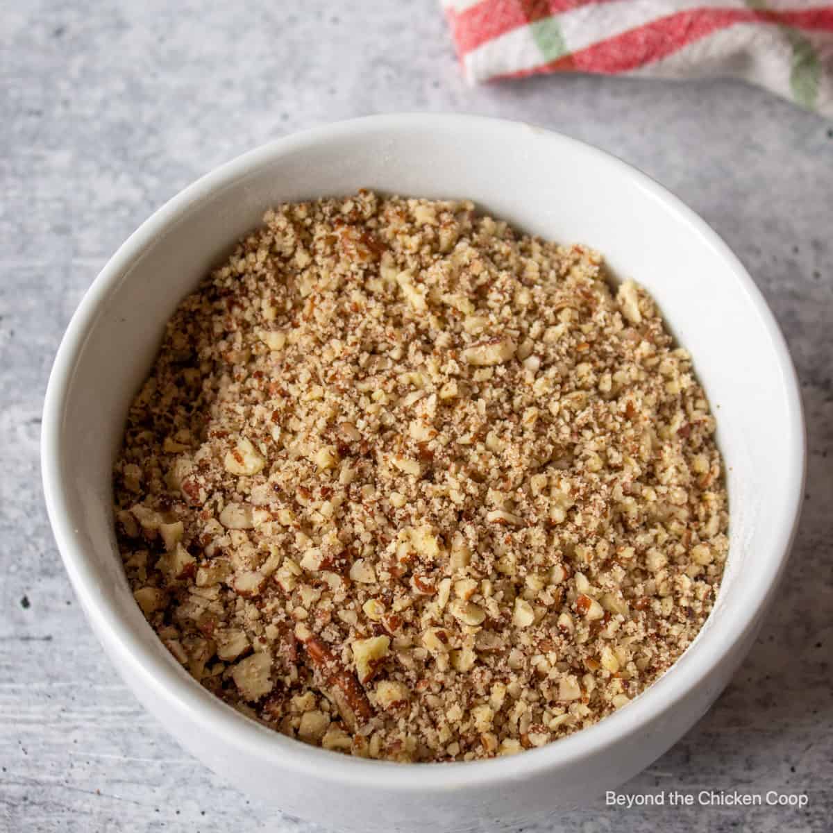 Finely chopped pecans in a bowl. 