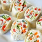 Tortilla pinwheels filled with cream cheese and veggies.