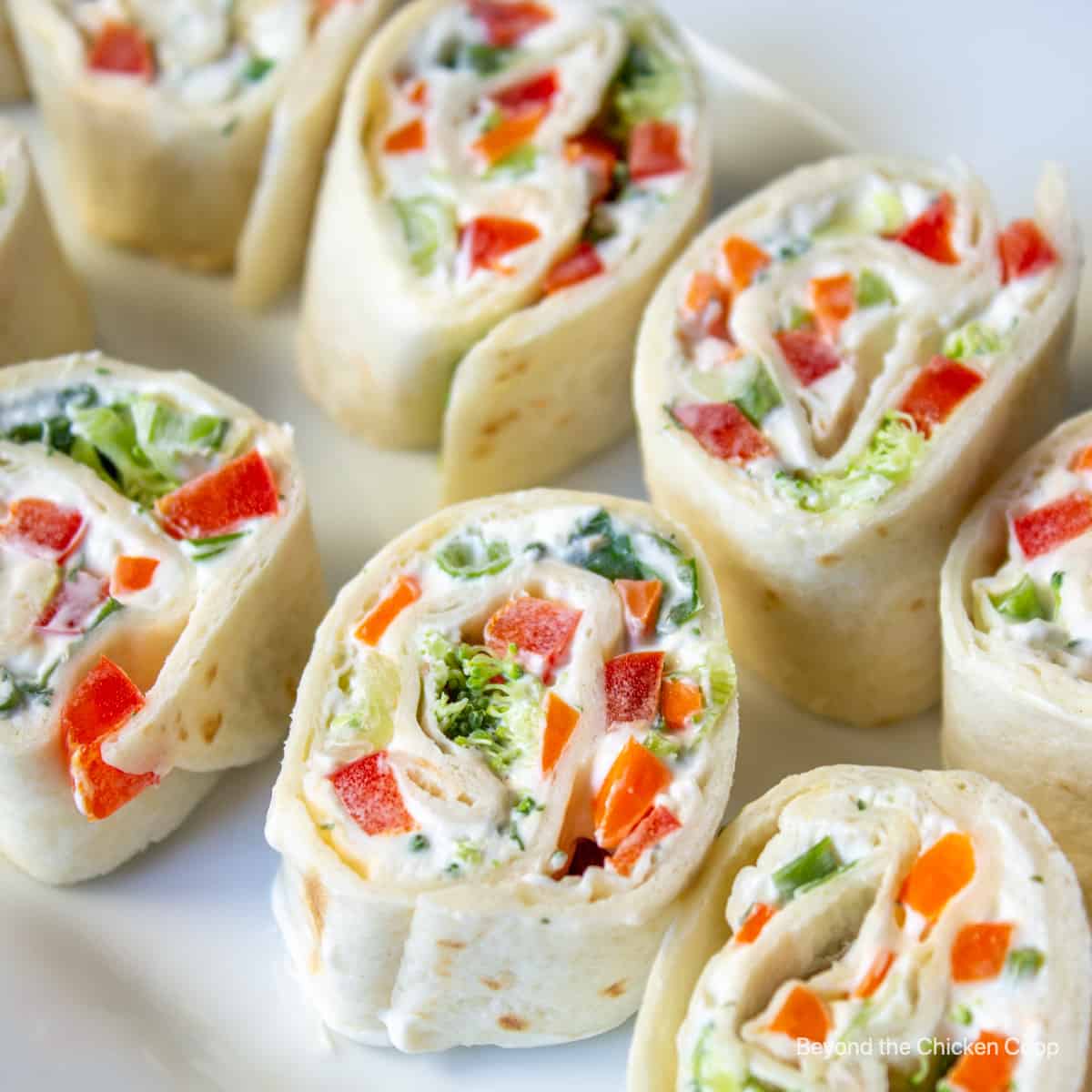 Tortilla pinwheels filled with cream cheese and veggies.