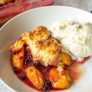 Blackberries and peaches in a biscuit topped cobbler.