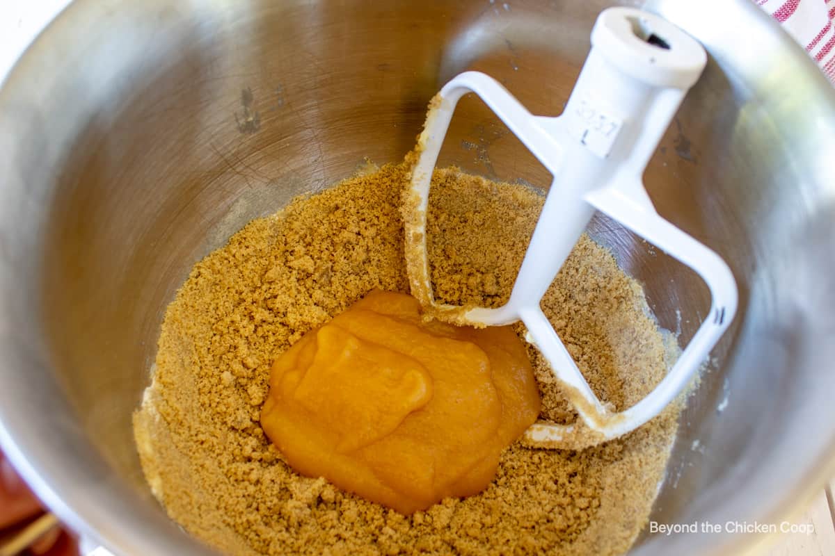 Applesauce in a mixing bowl with flour.