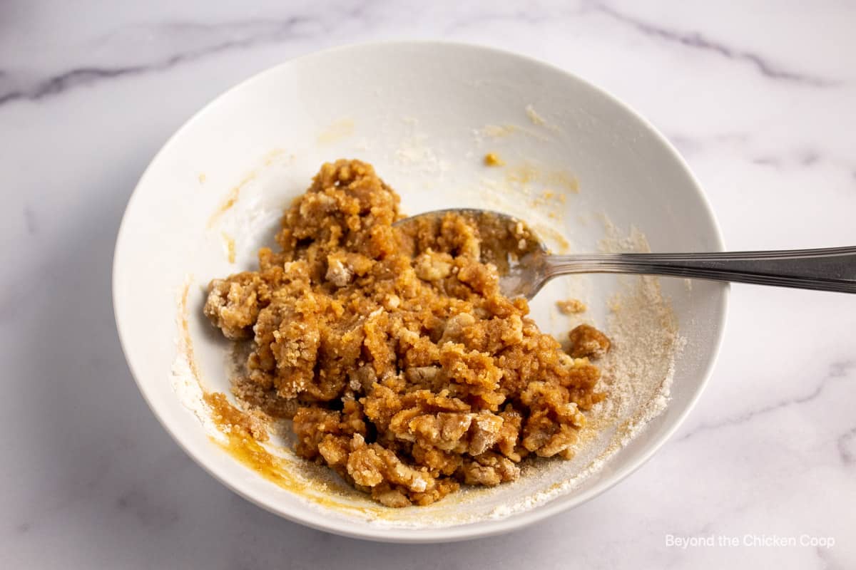 Mixing a crumble topping.