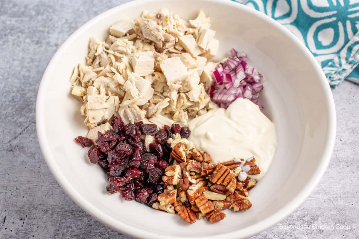 Chicken salad ingredients in a bowl.