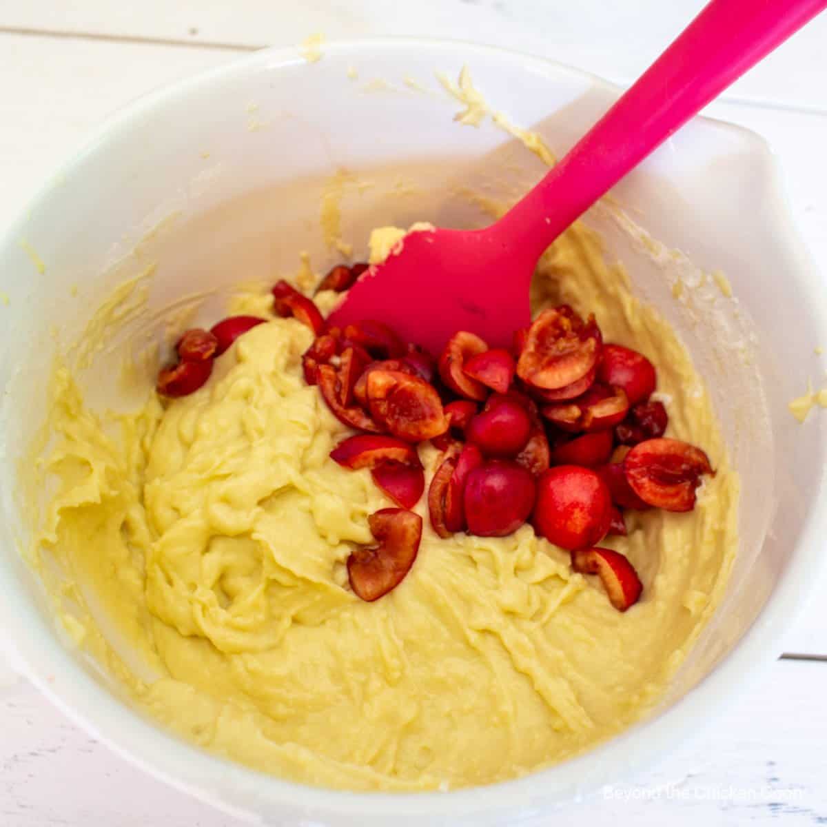 Fresh cherries added to muffin batter.