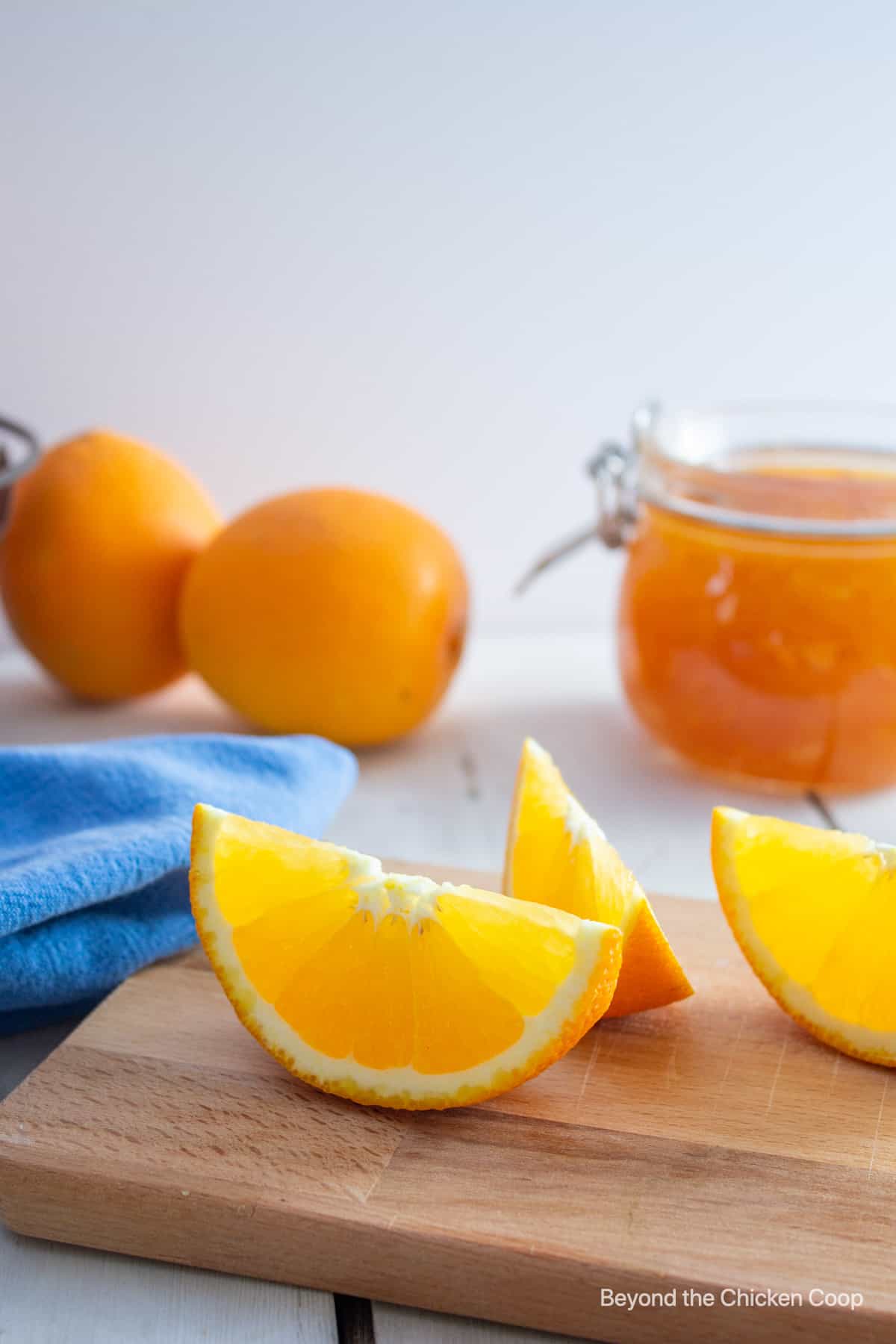 Orange slices on a cutting board.