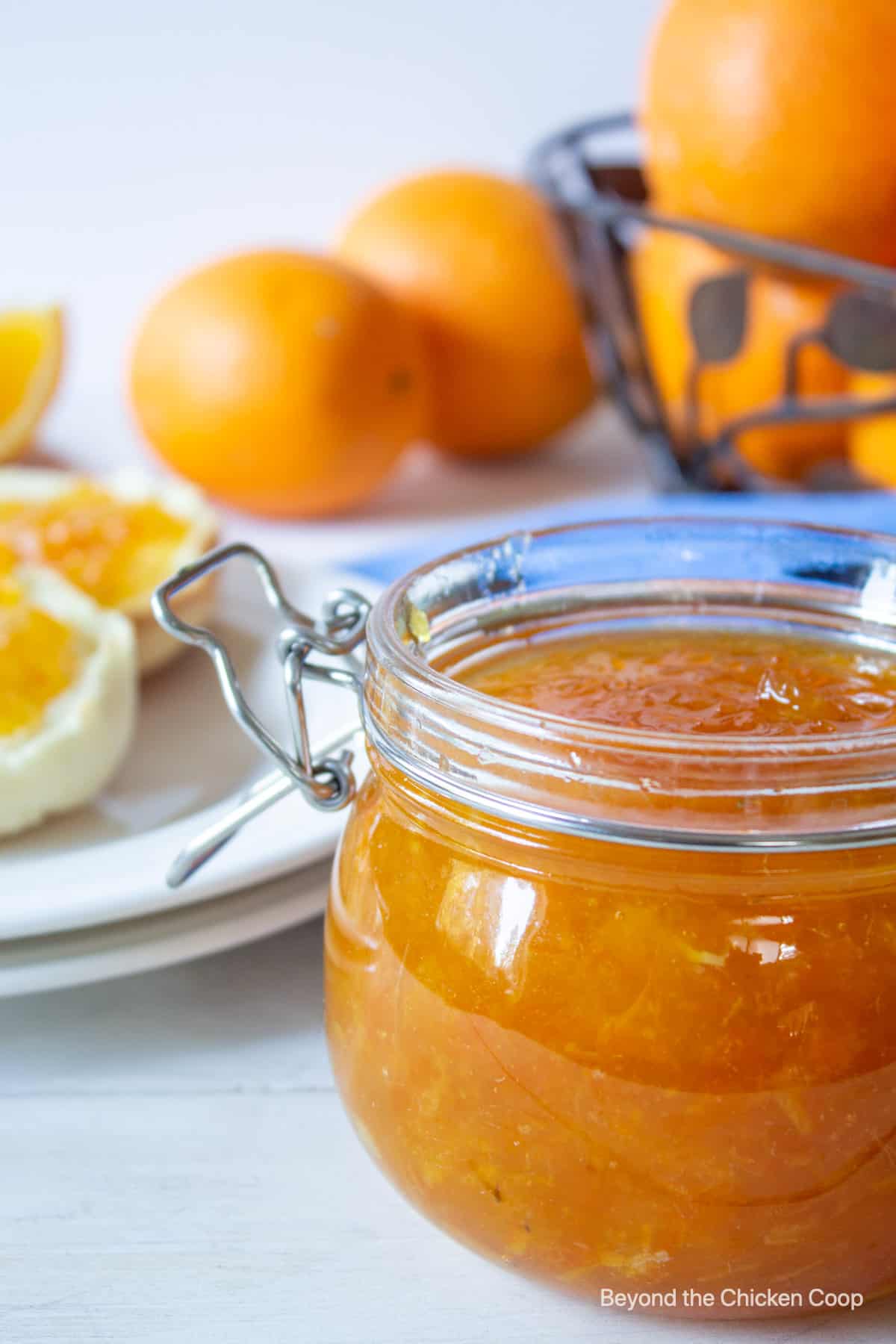 Orange jam in a glass jar.