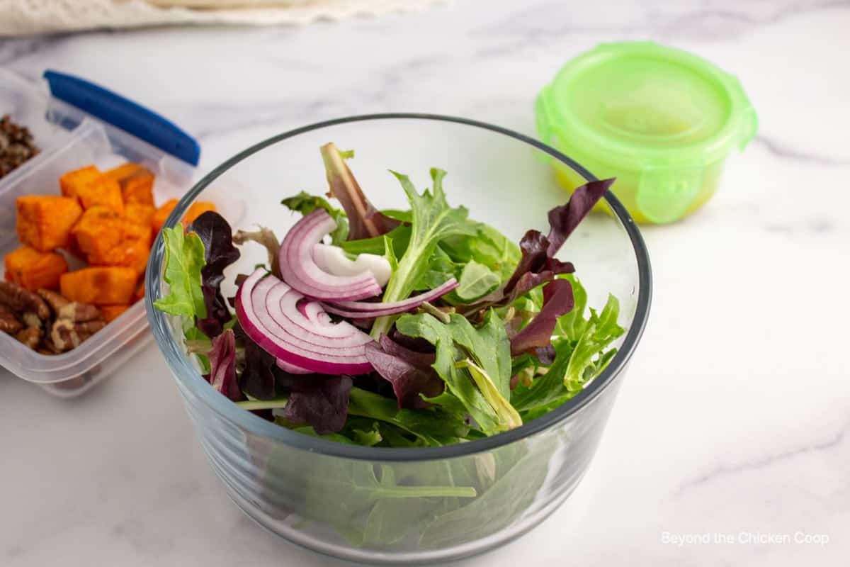 Salad in a glass storage container.