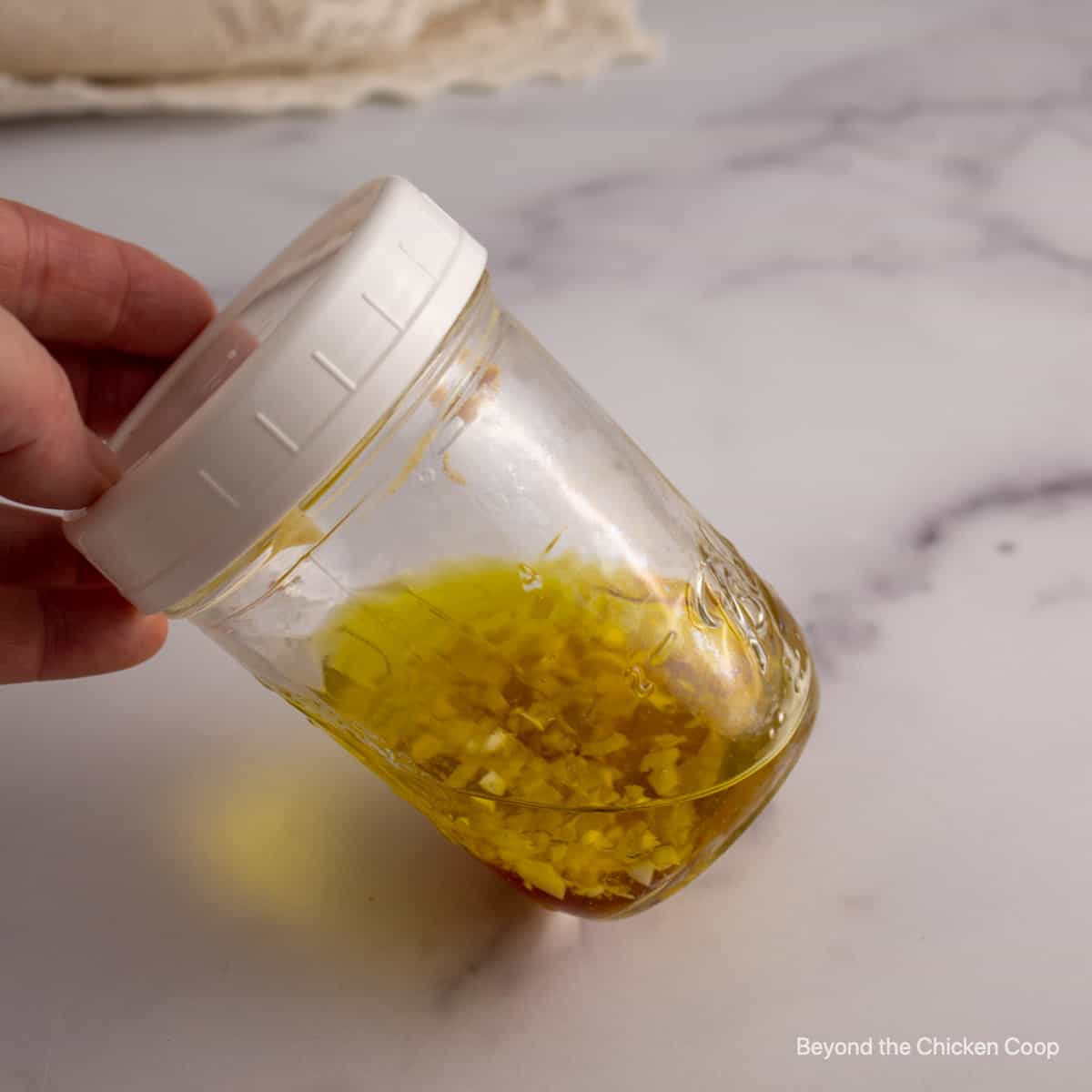 Salad dressing ingredients in a jar.