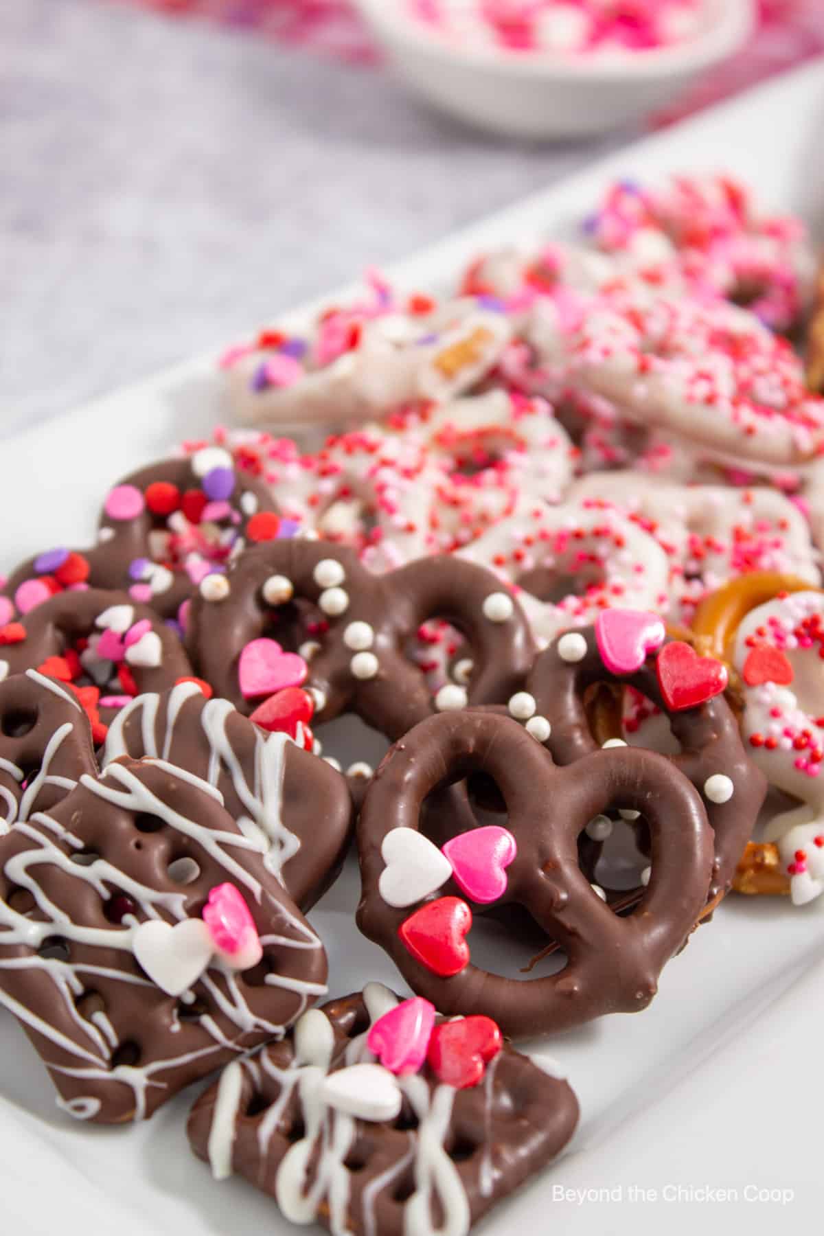 Pretzels with chocolate and valentine candies.